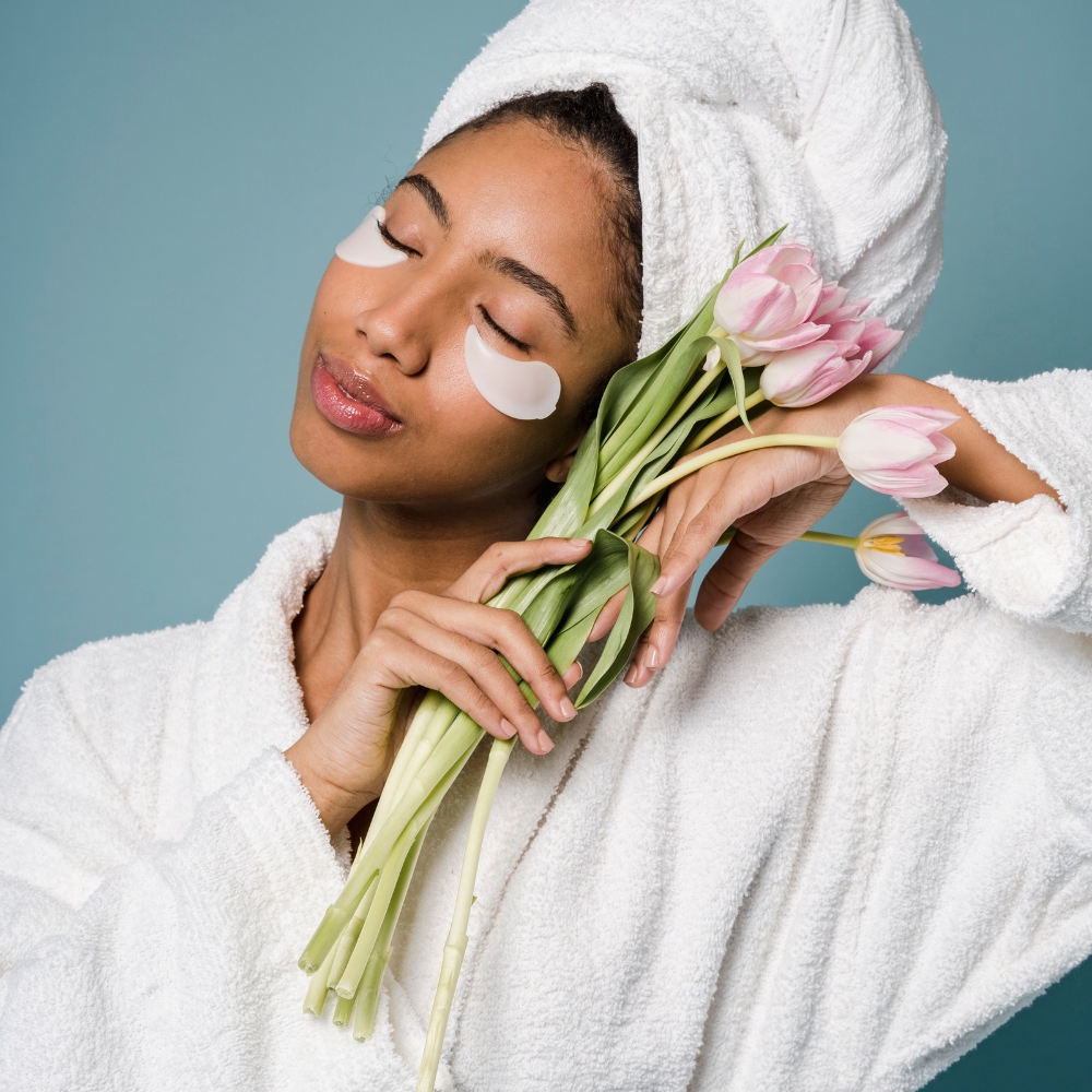 A tranquil spa room with neatly folded towels and natural products.