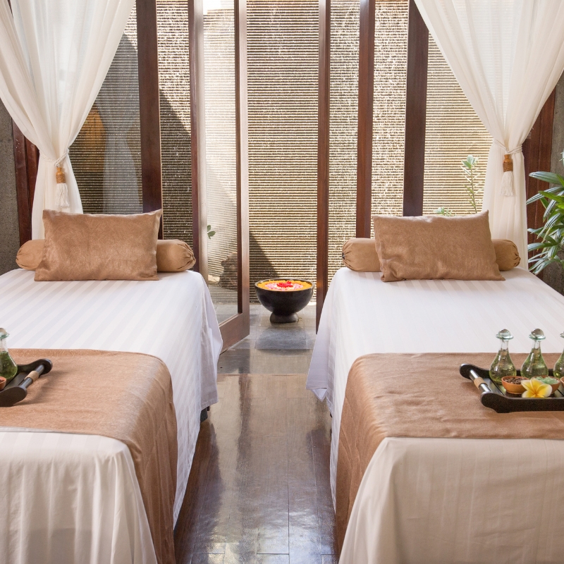 Cozy massage room with two beds